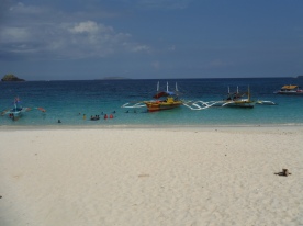 boats dock in front of the beach